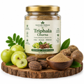 Ayurvedic Triphala Churna powder in glass jar